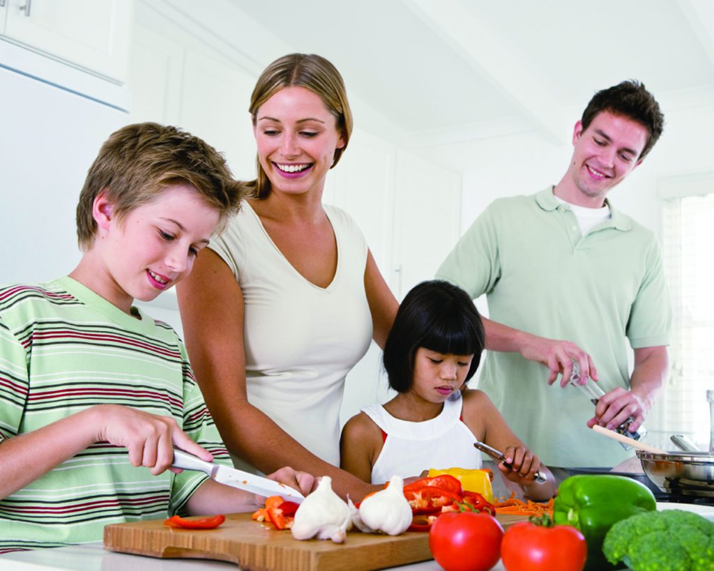 Family experimenting with cooking in the kitchen